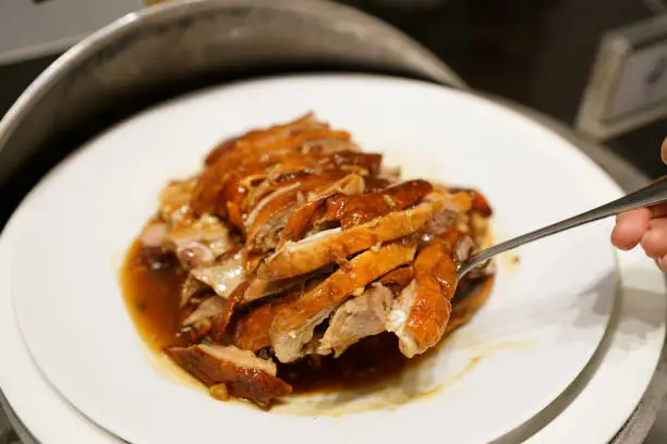 Photo of Grilled Peking duck - A plate of homemade roasted duck, Chinese food style.