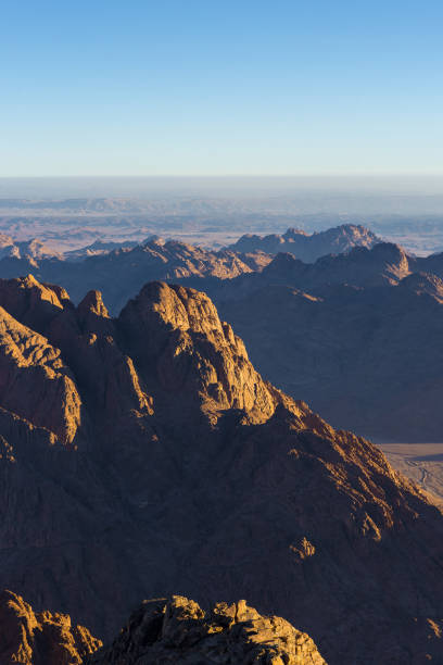 istock Beautiful view from the mountain. Panorama. Mountain range with visible silhouettes through the morning blue fog 1159956890