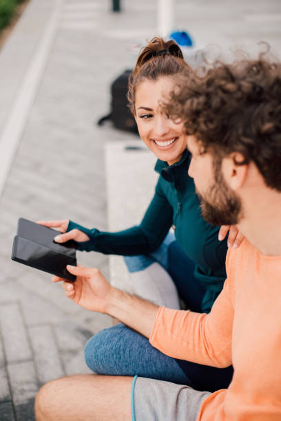 istock Girl sharing battery with boyfriend 1159960882