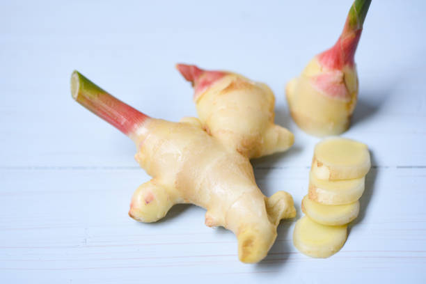 istock Ginger slice on table - Fresh young ginger for herb medicinal natural and food 1159961141