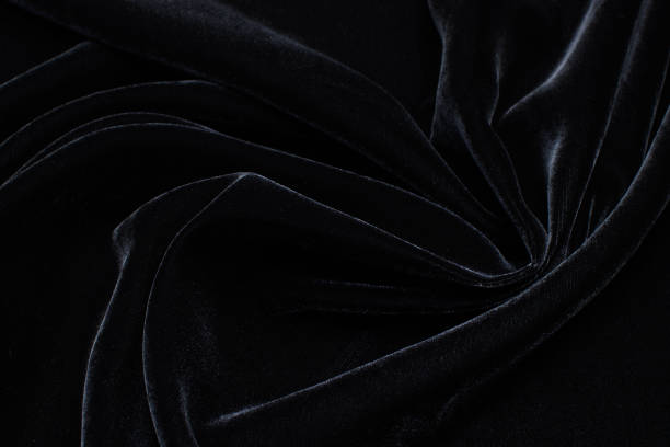 istock Silk fabric with viscose, velvet. Black colour. Texture, background, pattern. 1159968467