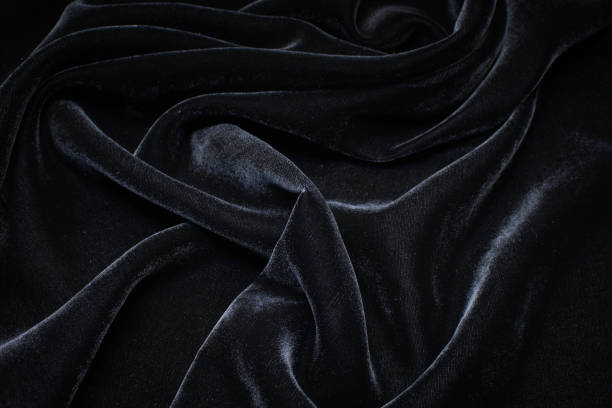istock Silk fabric with viscose, velvet. Black colour. Texture, background, pattern. 1159968471