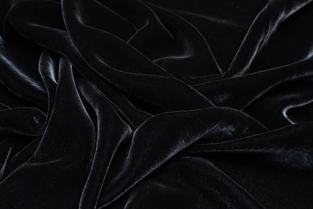 istock Silk fabric with viscose, velvet. Black colour. Texture, background, pattern. 1159968476