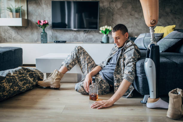 istock Veteran US soldier with one leg drinking alcohol 1159969421