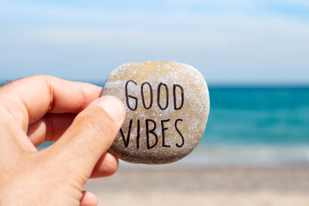 istock text good vibes in a stone on the beach 1159970874