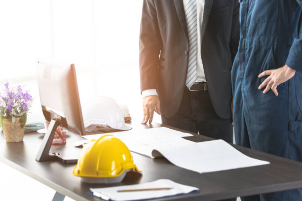 istock Some people discuss about blueprint in office. 1159971244