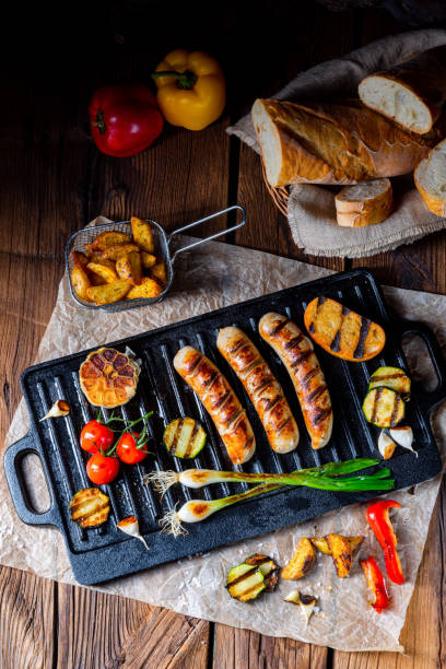 istock Delicious  grilled sausage with various grilled vegetables 1159971333