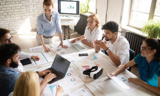 istock Happy creative team in office. Business, startup, design, people and teamwork concept 1159975008