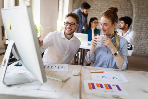 istock Business, technology and people concept - creative team or designers working in office 1159975079