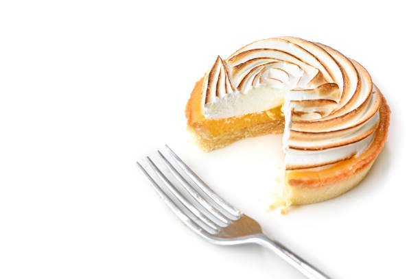 istock Lemon meringue tart on white background 1159975299