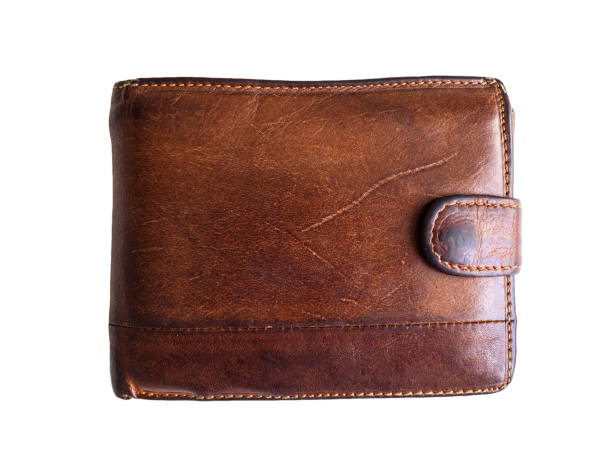 istock Old shabby and scratched wallet. Wallet brown on white background 1159975788