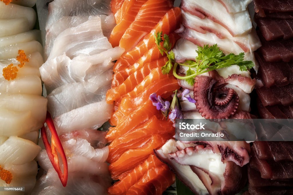 Sashimi From Different Types Of Fish On Ice Top View Stock Photo
