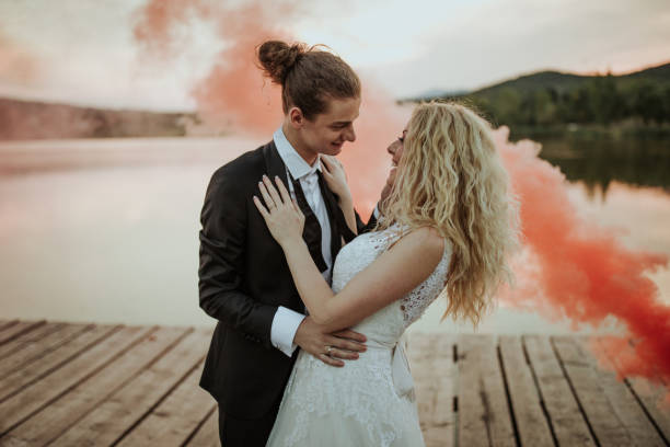 istock Happy newlyweds by the lake 1159976796