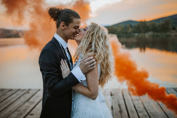 istock Happy newlyweds by the lake 1159977157