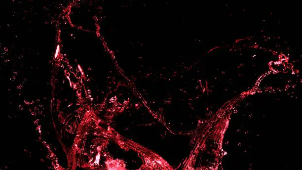Abstract red wine splash shape on black background. Bavaragers and drink graphic element
