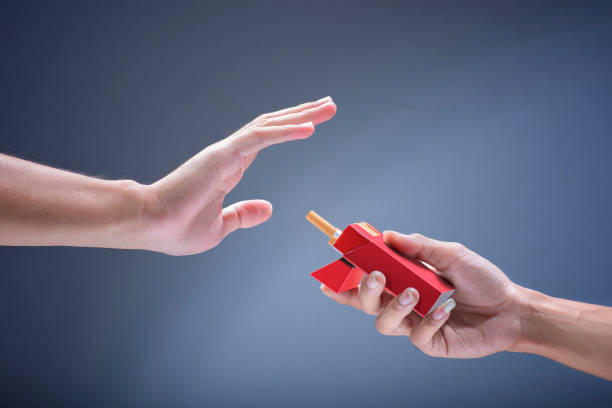 istock Man hand refuse of cigarette offer from other people 1159978516