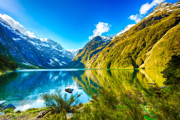 Lake Marian Peaks of Darran Mountains reflecting in a Lake Marian, Fiordland national park, New Zealand South island new zealand stock pictures, royalty-free photos & images