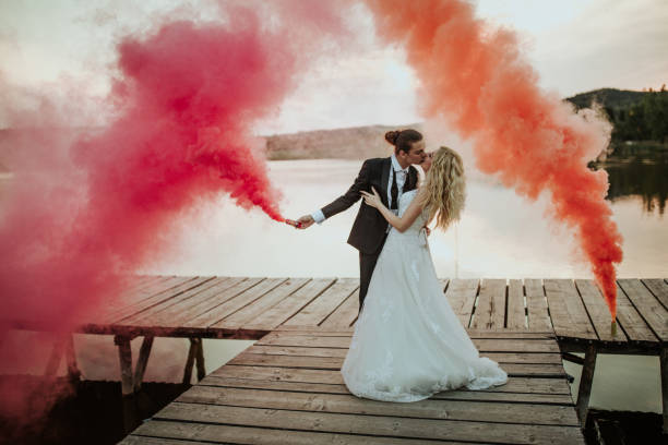 istock Happy newlyweds by the lake 1159979486