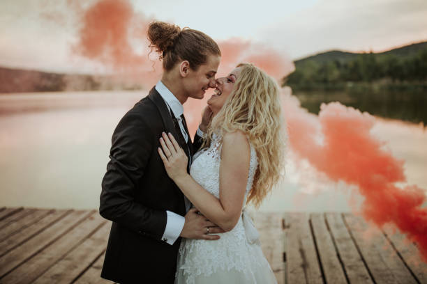 Happy newlyweds by the lake