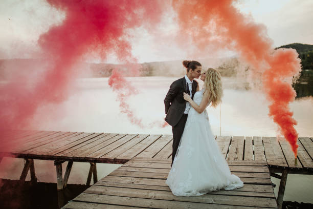 istock Happy newlyweds by the lake 1159979830
