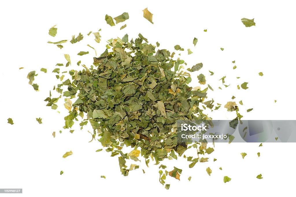 Pile of chopped coriander leaves Pile of chopped coriander leaves isolated on white background. Chopped Food Stock Photo
