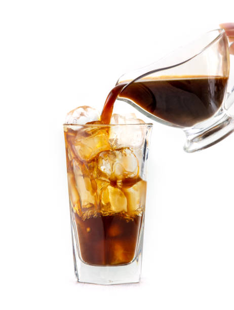 istock coffee pouring into glass of ice 1159982628