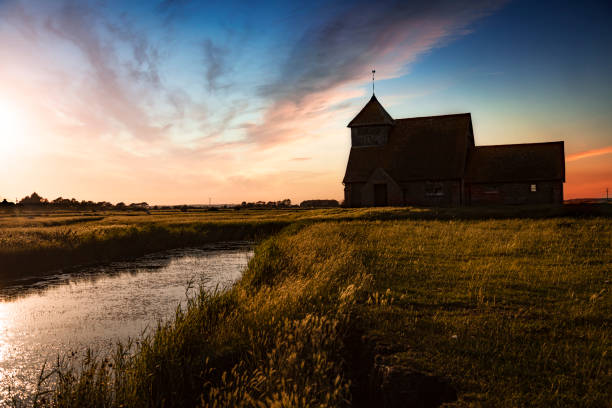 Small church in field of sheep, remote location on Romney Marsh