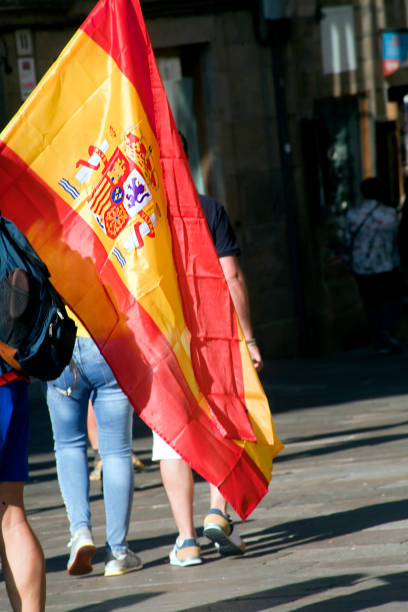istock Tourist holding spanish flag 1159984129