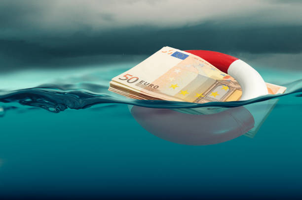 euro rescue concept - bank note modified - debt finance despair water imagens e fotografias de stock