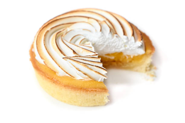 istock Lemon meringue tart on white background 1159985296