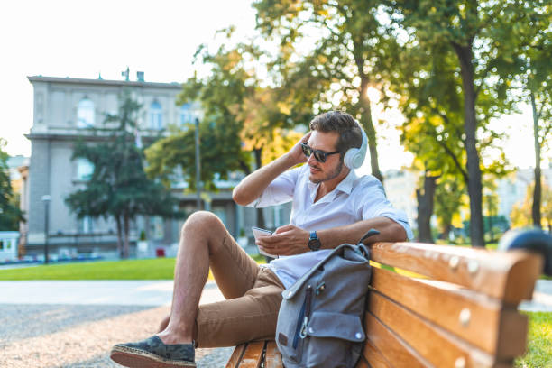 istock Man playing with his smart phone 1159987454