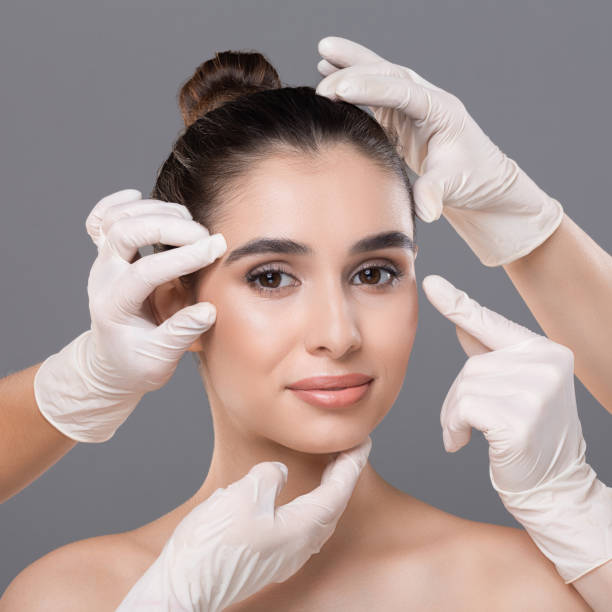 istock Young woman getting consultation at plastic surgery clinic 1159988092