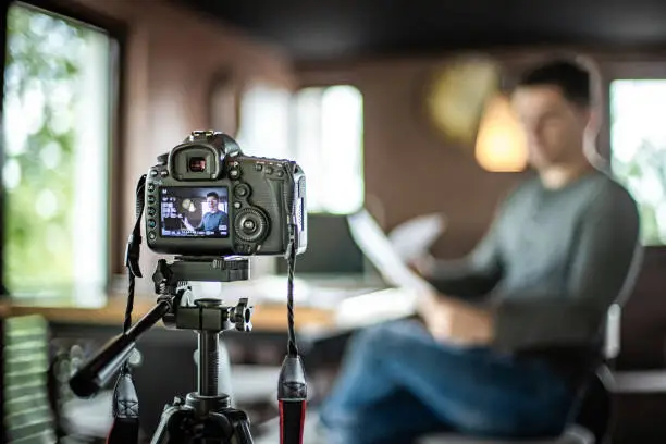 Photo of Vlogger recording content for his vlog