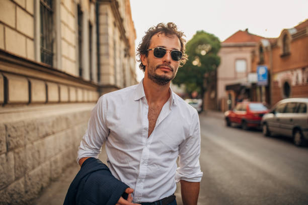 istock Gentleman standing on the sidewalk 1159989023