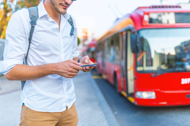 istock Male tourist tracking GPS on smartphone device using wireless internet on urban setting 1159989029