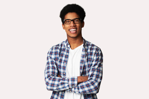 istock Happy Afro Student Standing with Arms Crossed 1159989428