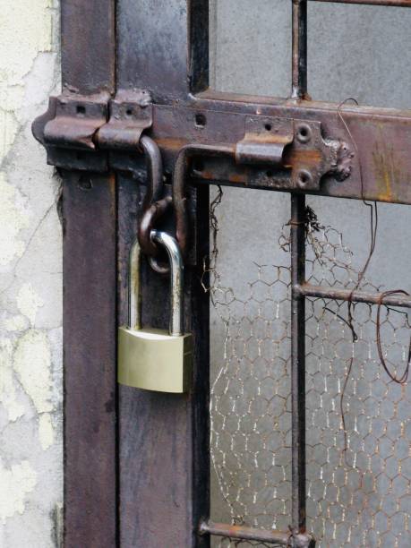 istock The Padlock Hanging on A Metal Door 1159991089