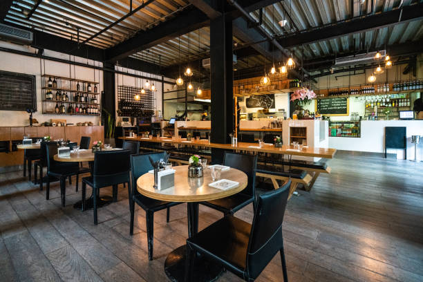 Cozy restaurant for gathering with friends Interior of cozy restaurant for gathering with friends, with tables, chairs, no people cafe culture photos stock pictures, royalty-free photos & images