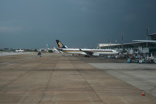 Singapore Airlines plane is about to get boarded and filled with luggages at Saigon airport, Ho Chi Minh City, Viet Nam