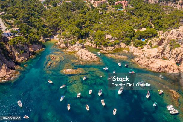 Aerial View Of Aigua Xelida Beach Bay With Boats In Begur Costa Brava Spain Stock Photo - Download Image Now