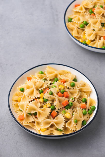 istock pasta with vegetable food background 1159993842