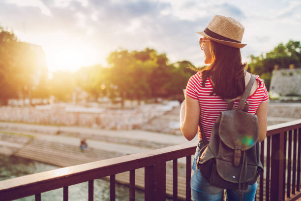 istock Young woman exploring city 1159994918