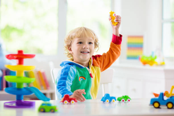 boy playing toy cars. kid with toys. child and car - 18640 imagens e fotografias de stock