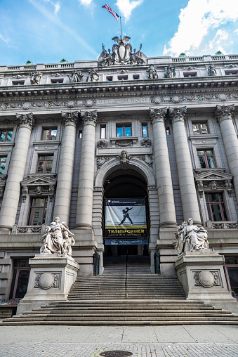 New York City, USA - August 1, 2018: Facade of the Alexander Hamilton U.S. Custom House in Manhattan, New York City, USA. The building is now the National Museum of the American Indian