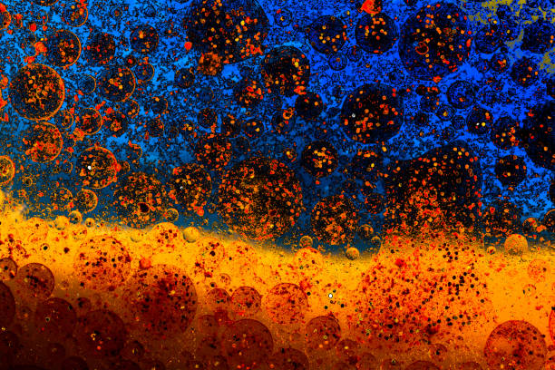 istock Macro shot of oil bubbles over colored background 1159996219