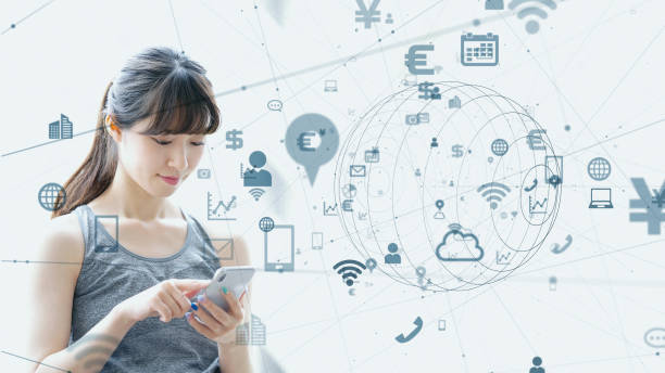 istock IoT (Internet of Things) concept. Asian girl using a smart phone. 1159996430