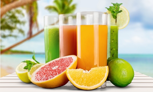 Various healthy juices with fresh fruits