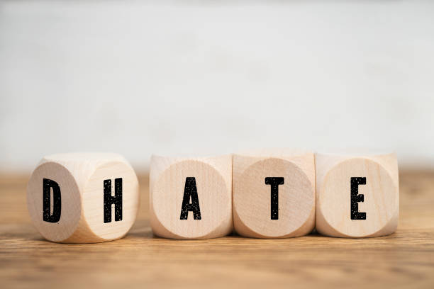 istock Cubes with letters on sides placed to spell HATE or DATE 1159999403