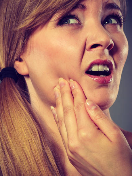 istock Woman suffering from tooth pain 1160000067