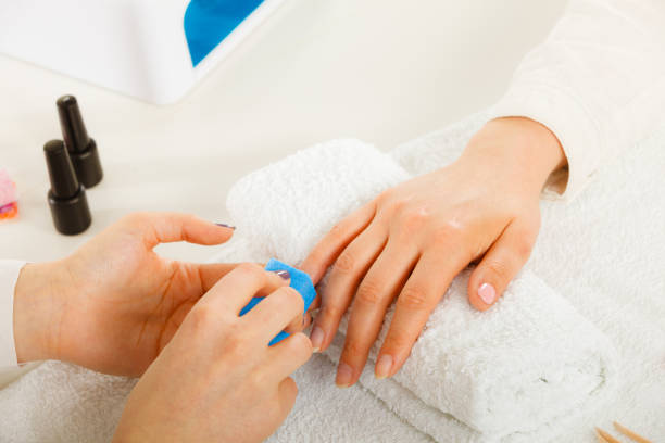 istock Woman getting manicure done file nails 1160000121